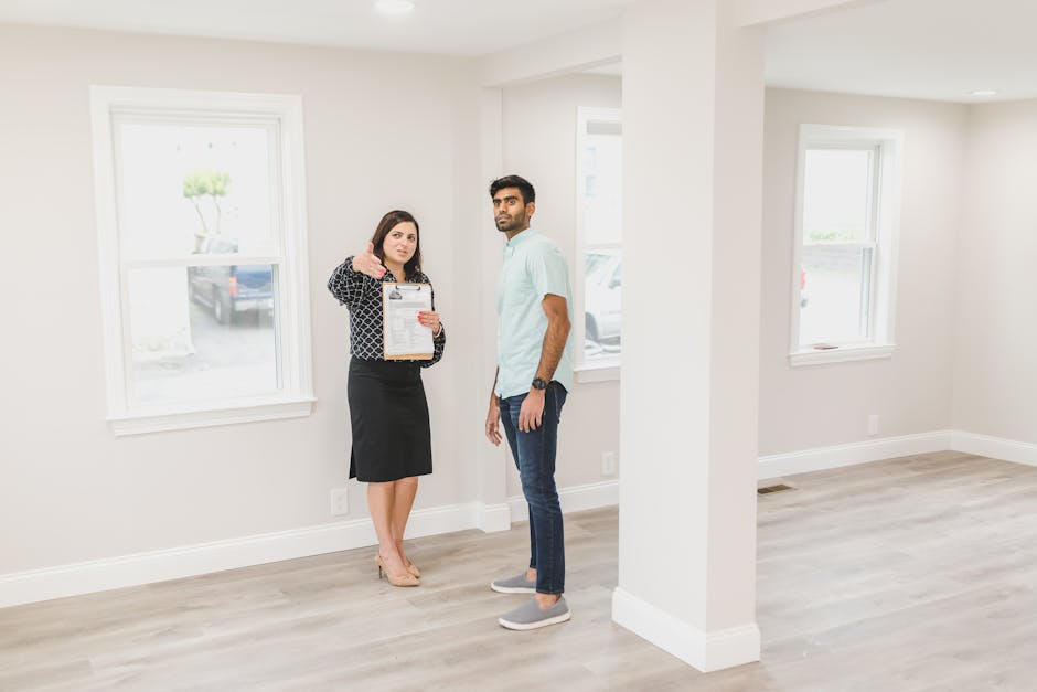 A real estate agent showing a potential buyer the interior of a new home